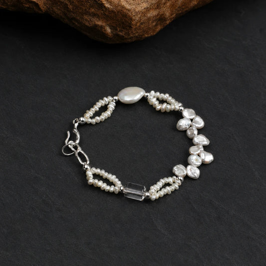 Close-up of baroque petal freshwater pearls on silver bracelet