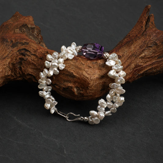 Close-up of amethyst and petal baroque pearl bracelet