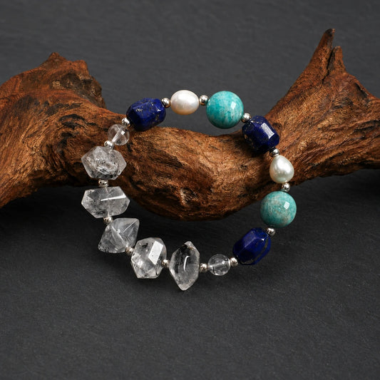 Close-up of black obsidian, lapis lazuli and amazonite bracelet